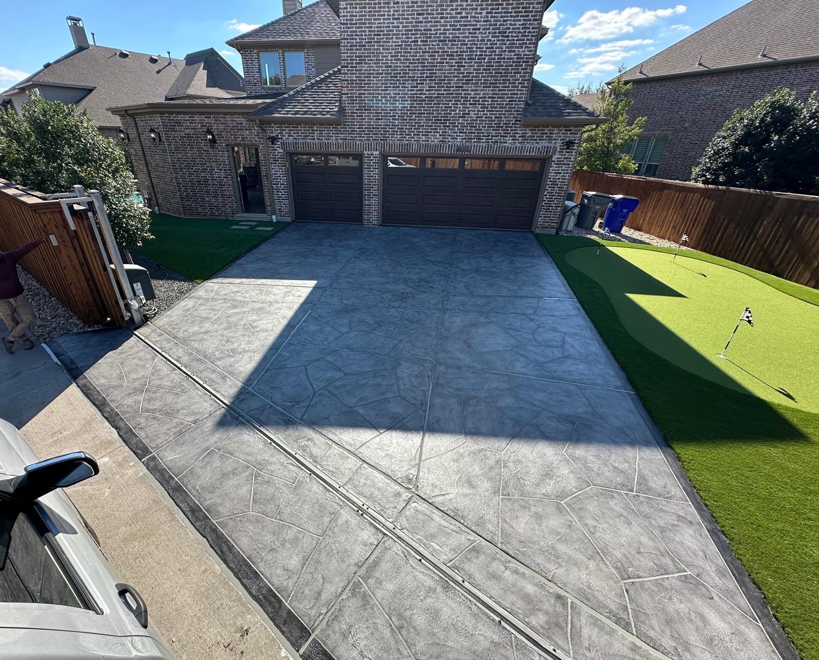 Decorative pool deck resurfacing finish for a residential outdoor space